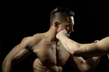 Obraz na płótnie Canvas Young muscular men boxing