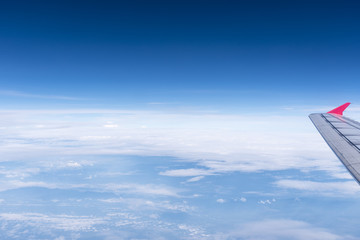 Naklejka na ściany i meble Skyline View above the Clouds from airplane