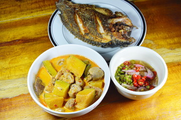 spicy pumpkin in coconut cream curry and deep fried mango fish