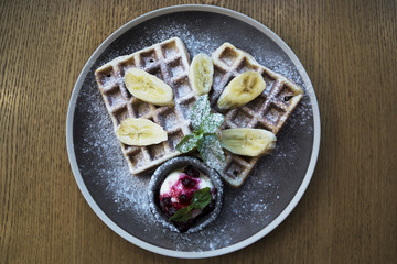 Belgian waffles with ice cream and bananas