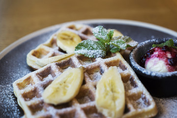 Belgian waffles with ice cream and bananas