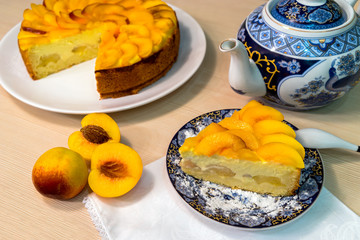 Piece of peach cake on the table