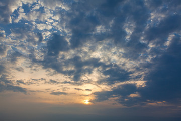 evening sun shines through the clouds