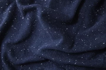 Photo sur Plexiglas Poussière A full page close up of speckled navy blue knit ware sweater fabric texture