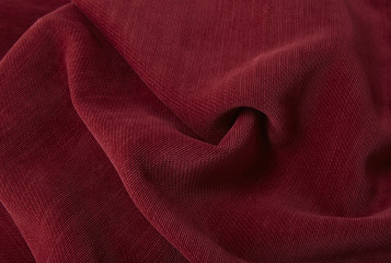 A full page close up of a red sofa upholstery fabric texture