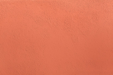 Naklejka premium Terracotta painted stucco wall. Background texture