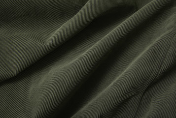A full page close up of green cord fabric texture