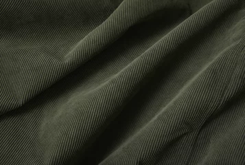 Photo sur Plexiglas Poussière A full page close up of green cord fabric texture