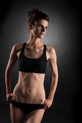 Obraz na płótnie Canvas Sport. Photo of pretty woman with trained abs