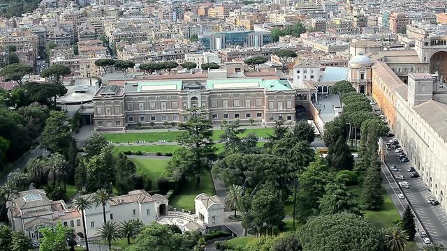 Aerial view of the Vatican gardens, the Vatican Museums (Musei Vaticani) and St.Peter's Square (Piazza San Pietro) in Vatican, Rome. Panning from left to right.