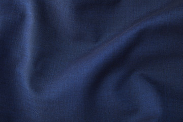 Fototapeta na wymiar A full page close up of rich blue suit material texture