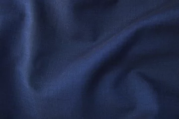 Photo sur Plexiglas Poussière Une pleine page en gros plan de la texture du matériau du costume bleu riche