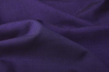 Obraz na płótnie Canvas A full page close up of rich purple suit fabric texture