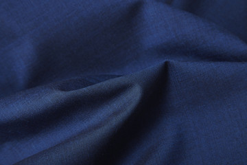 Fototapeta na wymiar A full page close up of royal blue suit fabric texture
