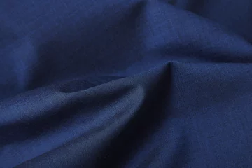 Crédence de cuisine en verre imprimé Poussière Une pleine page en gros plan de la texture du tissu du costume bleu royal