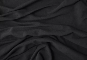 Photo sur Plexiglas Poussière A full page close up of folds of soft black cotton fabric texture