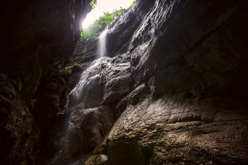 Waterfall in a mountain gorge