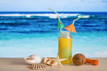 Watermelon smoothie and sea shells