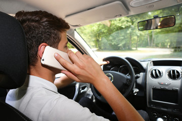Man phoning while driving a car