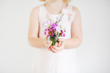 Girl holding a bouquet of flowers