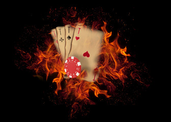 Playing cards and chips on fire. casino concept