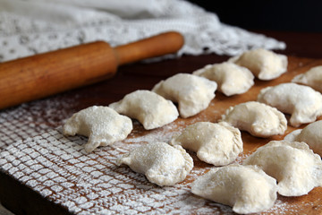 Fototapeta na wymiar Homemade pierogi vareniki - filled dumpling, traditional East Eu