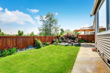 Beautiful landscape design for backyard garden and patio area - 118550598