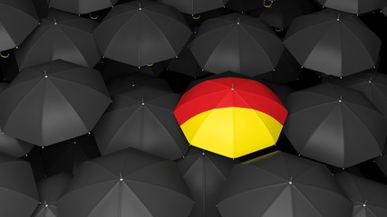 German flag on umbrella over black umbrellas