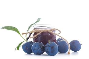 plum jam in a glass jar