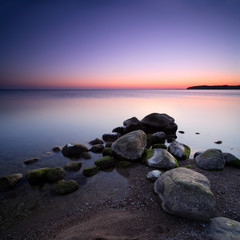 Fototapeta na wymiar Coastal Sunset, Huge Boulders in the Baltic Sea, Rugen Island, Germany 