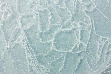 Obraz premium The pattern of cracks on the blue ice of Lake Baikal