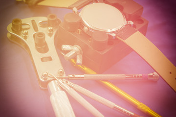 watch and tools for repiare scene on sweet vintage filter
