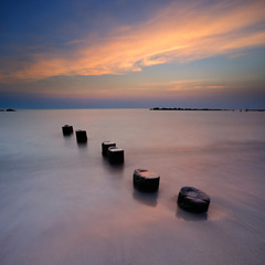 Fototapeta na wymiar Coastal Sunset, Beach with Wooden Groyne, Darss peninsula, Germany