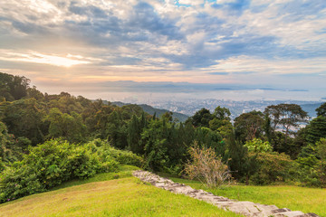 Metropolitan cityscape view from top of the hill or mountain during sunrise sunset