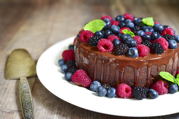 Chocolate cake with fresh forest berries.