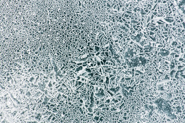 Net pattern of cracks on the blue ice of Lake Baikal