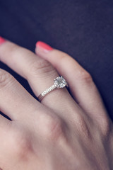Woman's hand wearing an engagement ring