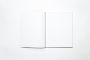 Blank open magazine isolated on white background
