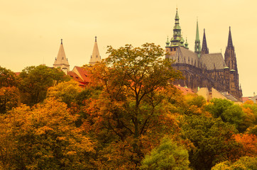 Fototapeta na wymiar Prague Castle, old city with autumn trees , european travel seasonal fall background in vintage style