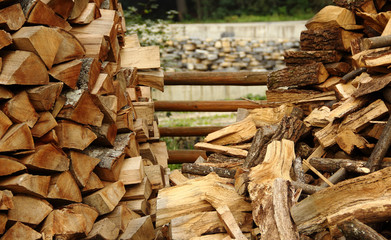 Wood stacking method. Firewood piles at countryside stock photo