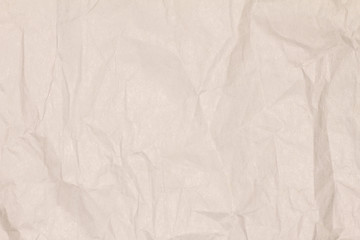Recycled crumpled light brown paper texture or paper background for design with copy space for text or image.