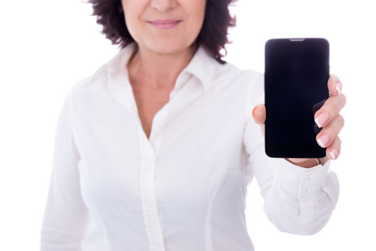 Mature Woman Showing Phone With Blank Screen Isolated On White