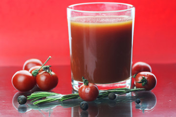 glass of tomato juice drops