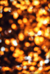 Holiday golden blurred bokeh . Abstract Christmas background.