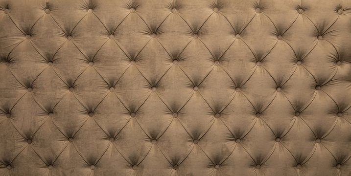 Beige capitone tufted fabric upholstery texture