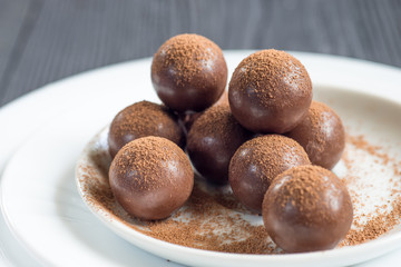 Assorted dark chocolate balls with cocoa powder