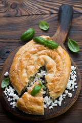 Burek or burekas pie with cheese and spinach, selective focus