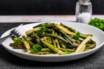 Fried green beans with sunflower seeds and parsley