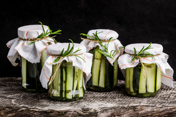 Marinated zucchini with rosemary in jars