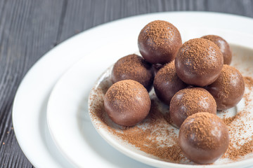 Assorted dark chocolate balls with cocoa powder